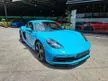 Recon 2019 Porsche 718 Cayman SportDesign Unreg #Miami Blue Seat Belts #Sport Exhaust In Black #Black Rear Apron And Spoiler #Alcantara Steering Wheel