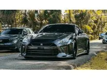 Finished in a menacing Metallic Black with a mix of carbon fiber parts over Black leather with Red Alcantara 2009 Nissan GT-R 3.8 Coupe