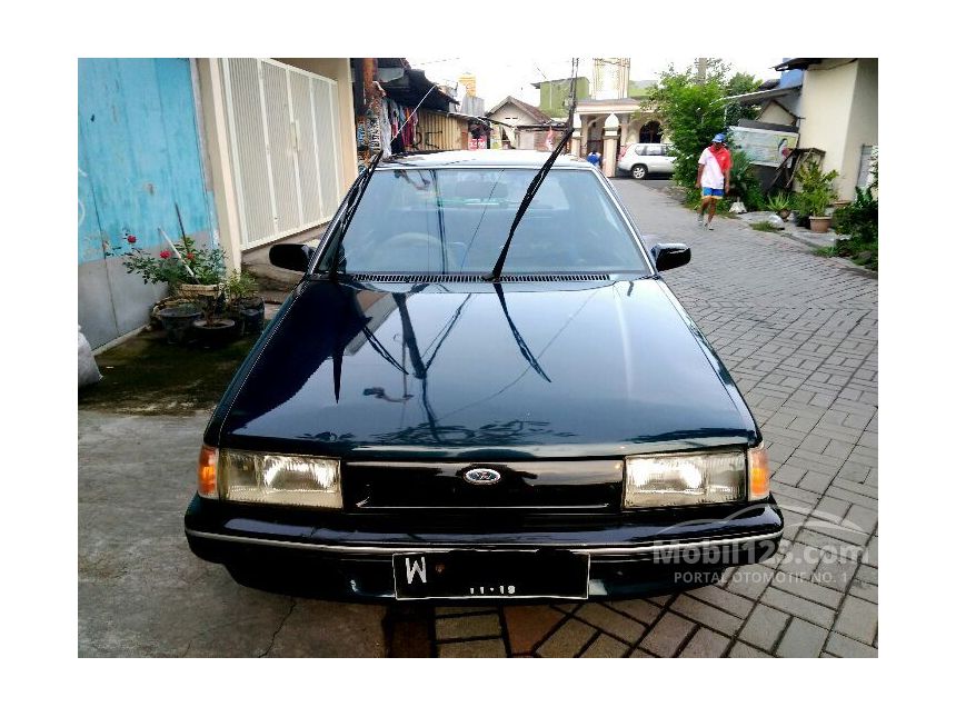 Jual Mobil Ford Laser 1996 1.3 di Jawa Timur Manual Sedan Biru Rp 22